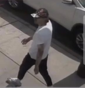 suspect with hat walking into Giddy's restaurant May 2026